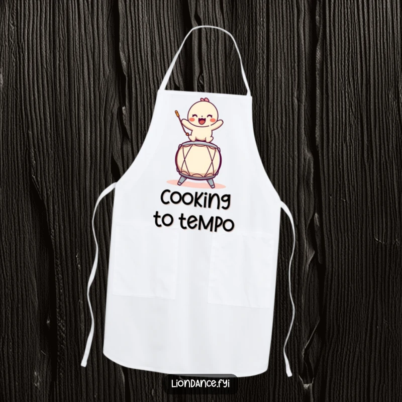 Funny kitchen apron with a playful character balancing on a stylized drum, ideal for cooking with musical humor.