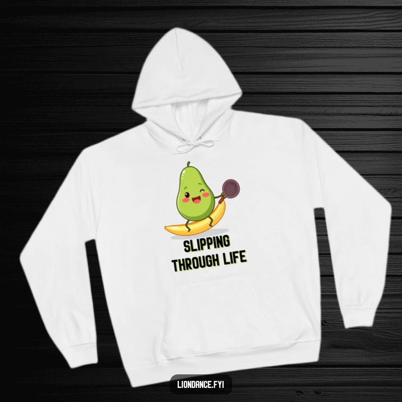 Funny cheerful avocado with small legs sliding on a banana peel while clutching a wok, depicted on a hoodie.